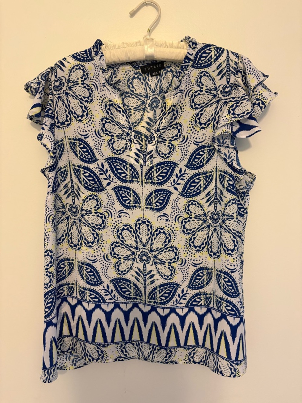 Blue and White Floral Print Ruffle Sleeve Blouse with a hind of yellow.